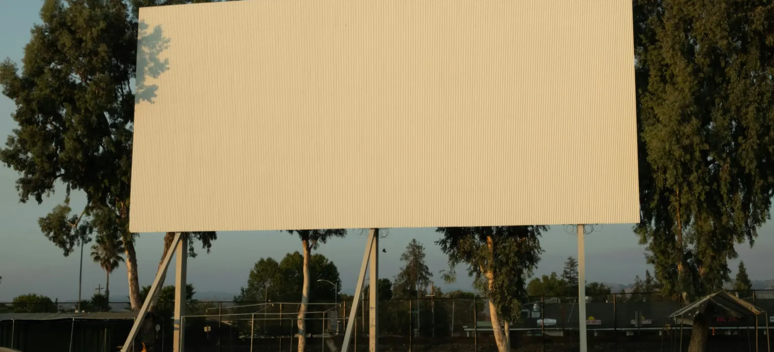 White and yellow building near trees during daytime