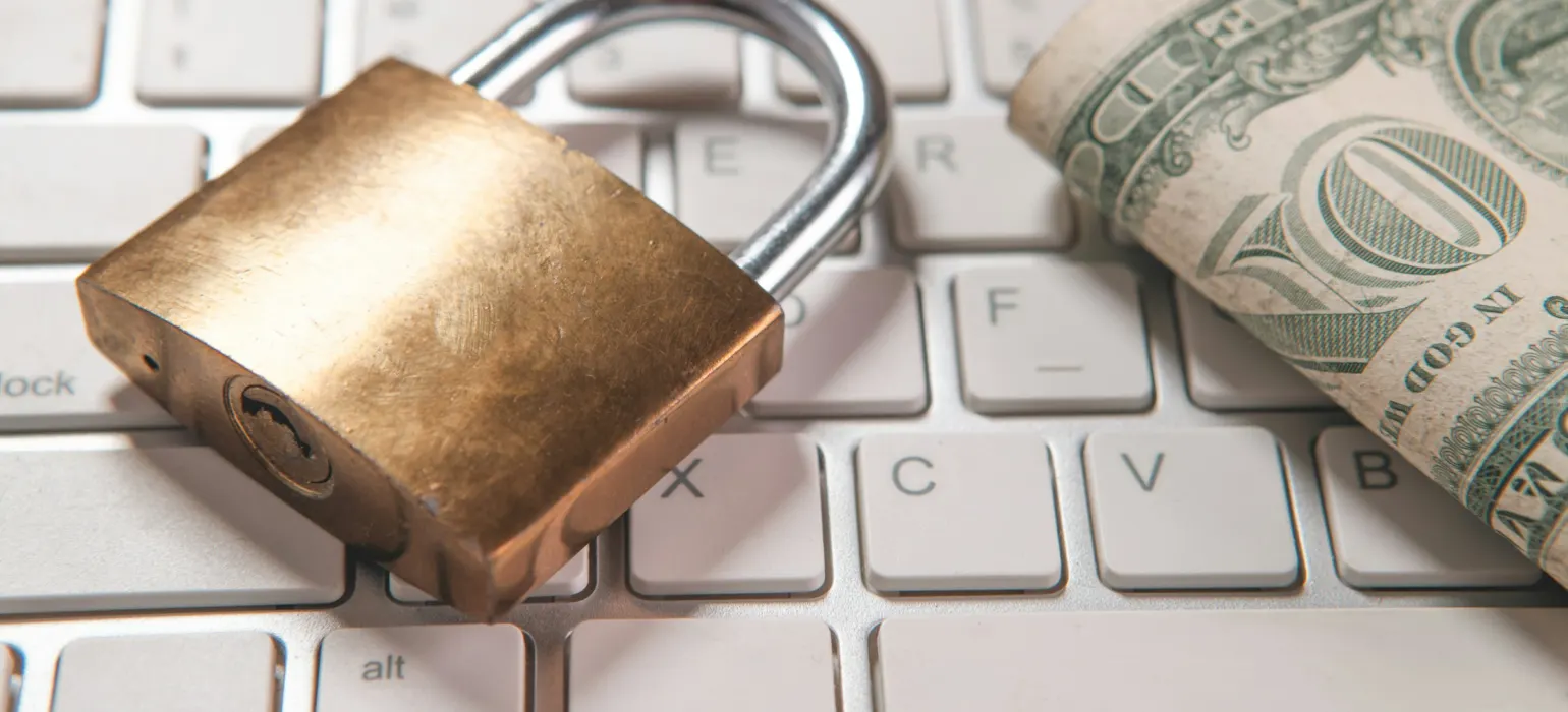 A padlock resting on a laptop keyboard