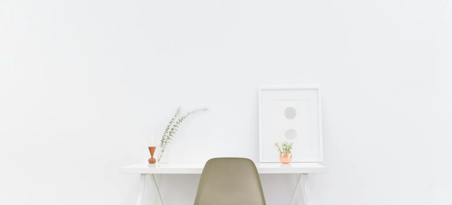 White wooden table near brown chair