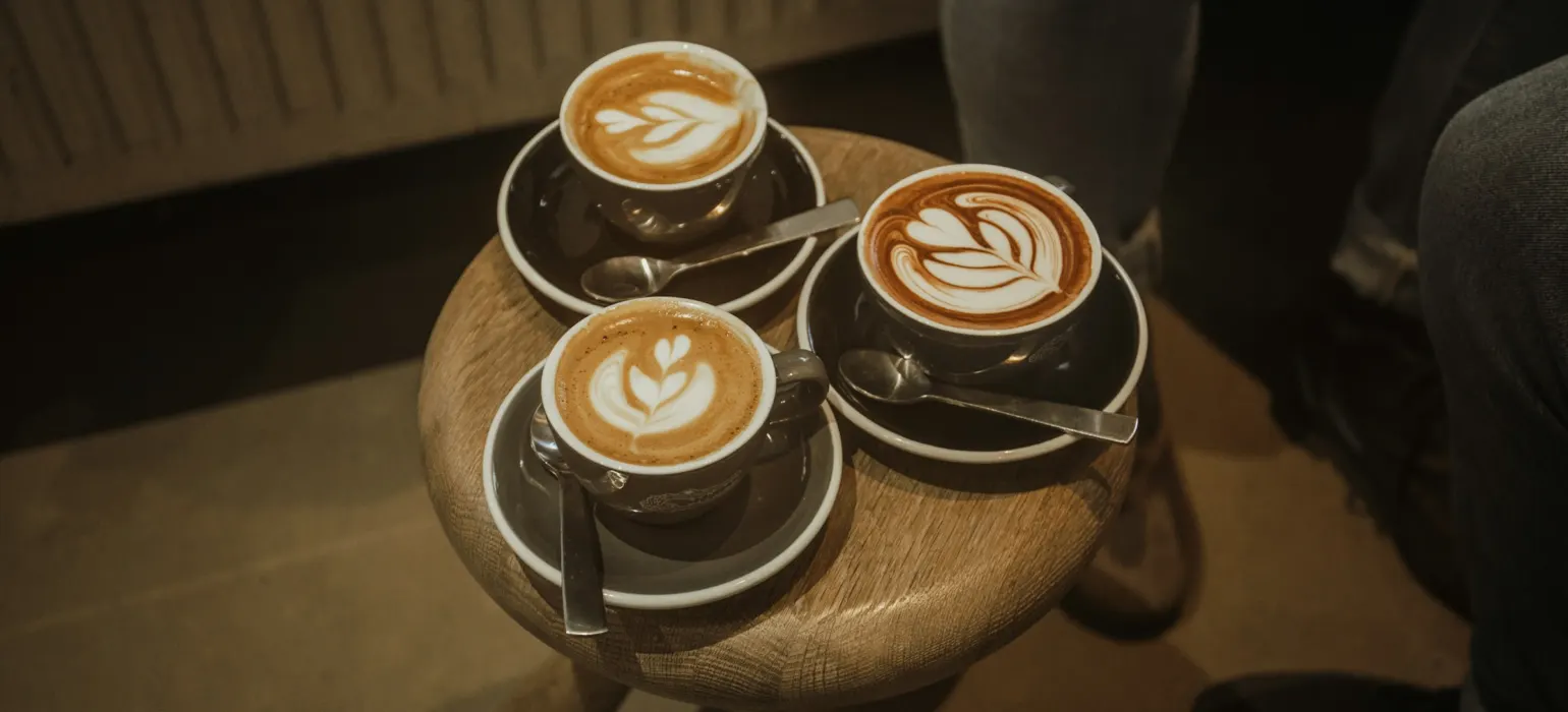 Three filled coffee cups