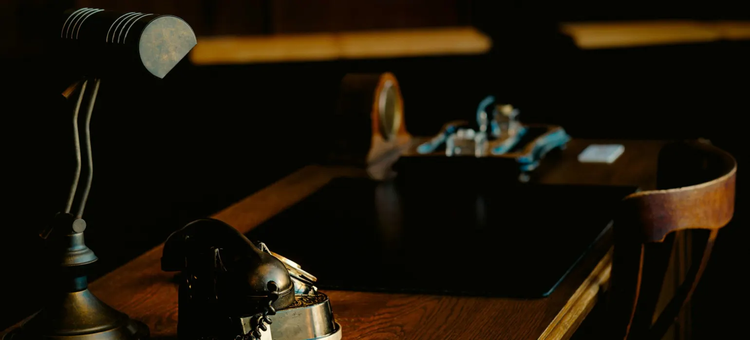 Vintage desk with lamp and ornate object