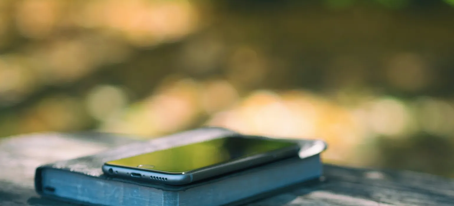 Space gray iPhone 6 on top of black book photo