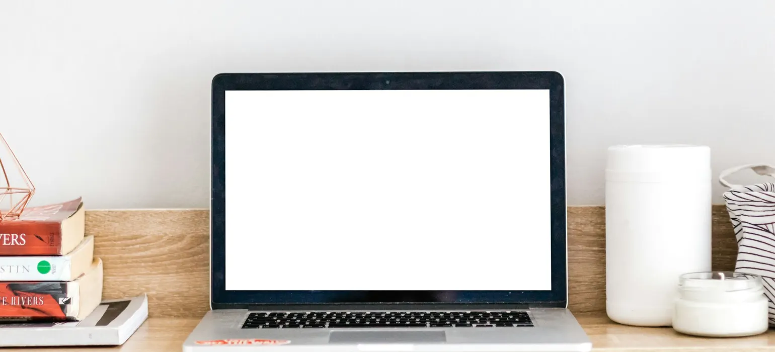 Turned-on MacBook on desk