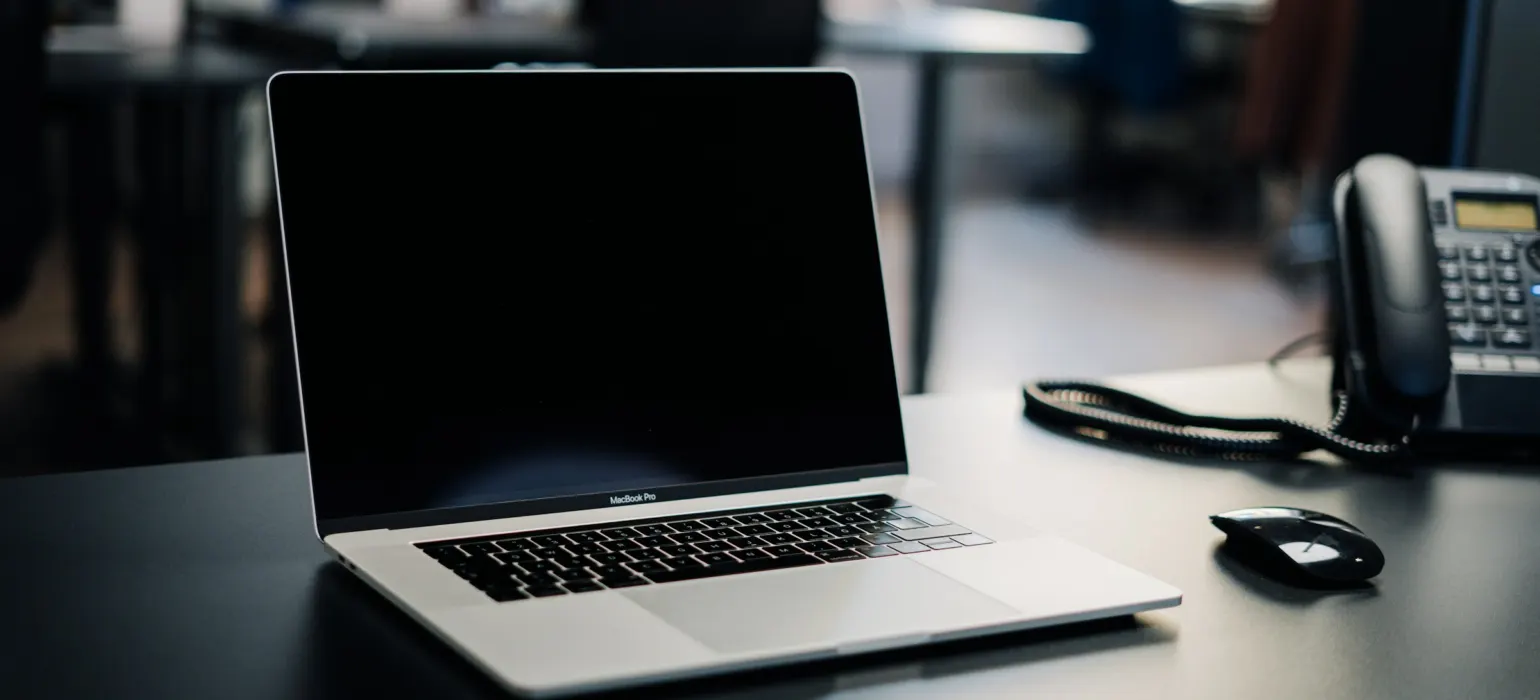 Macbook pro on white table