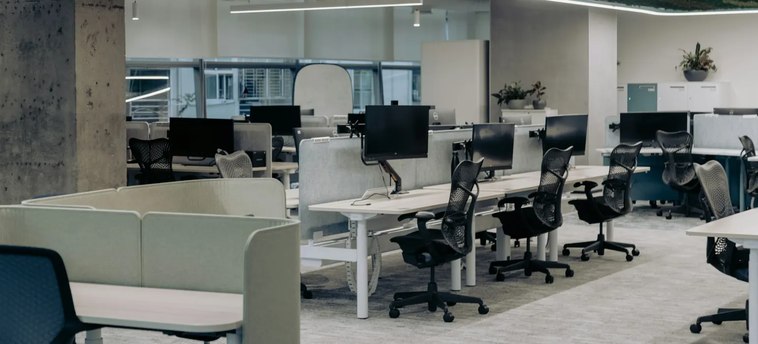 An office with a lot of desks and chairs