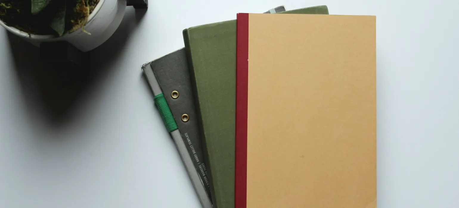 Brown folder on white table