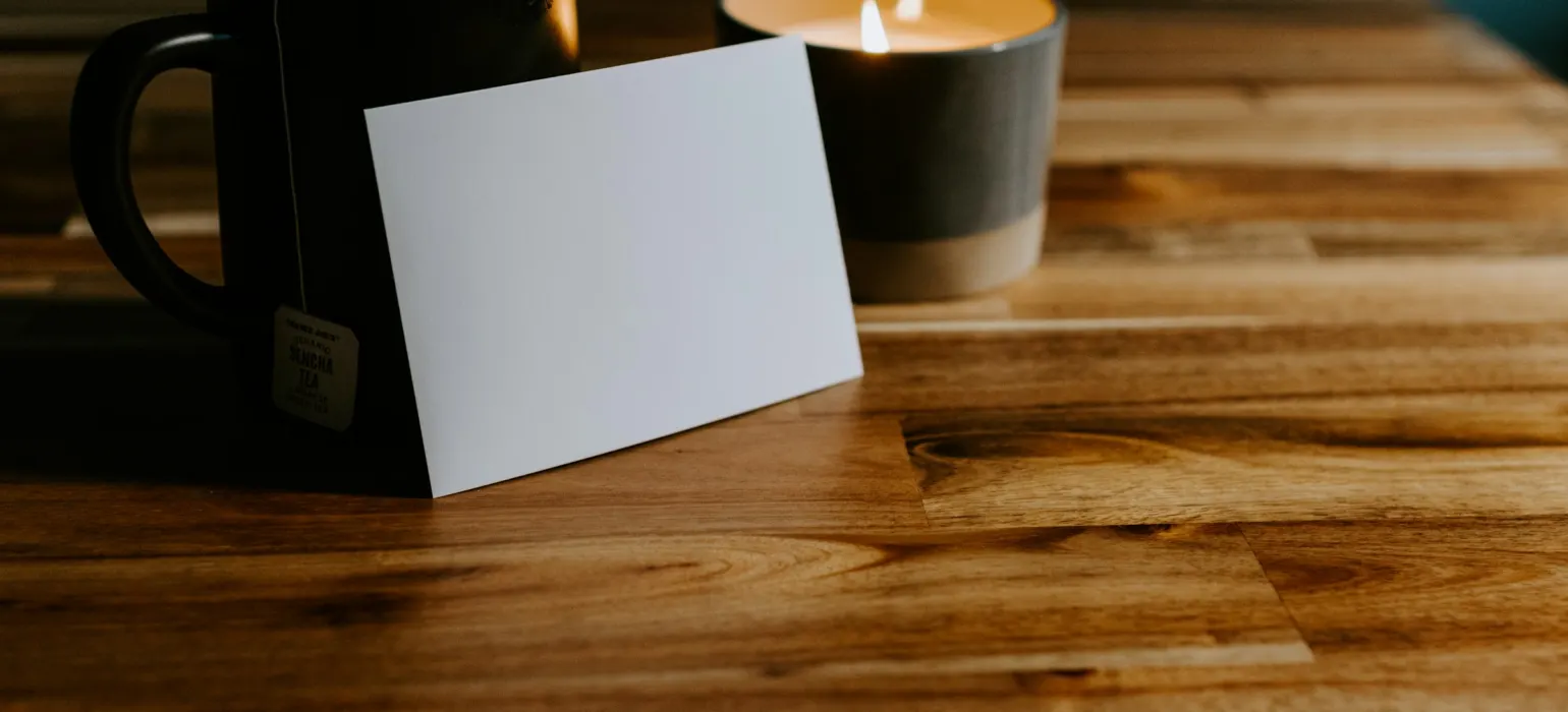 3 white candles on brown wooden table