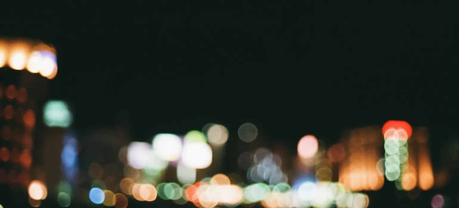 A blurry photo of a city at night