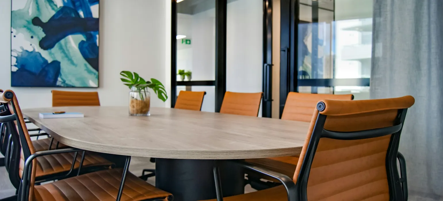 Brown wooden 9-piece office table and chairs