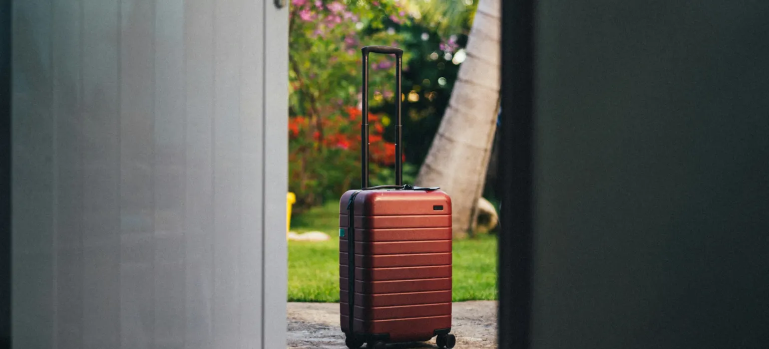Red and black luggage bag