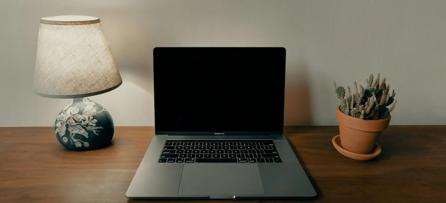 Macbook pro on brown wooden table