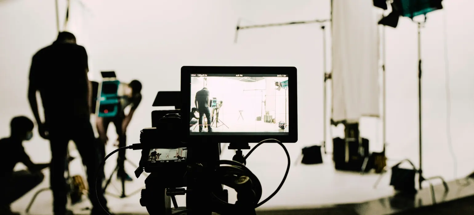 A camera set up in front of a white background