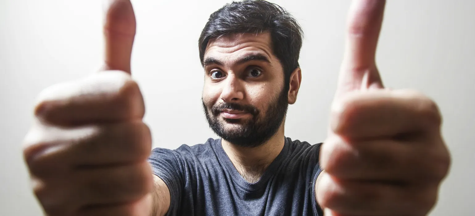 Man giving two thumbs up