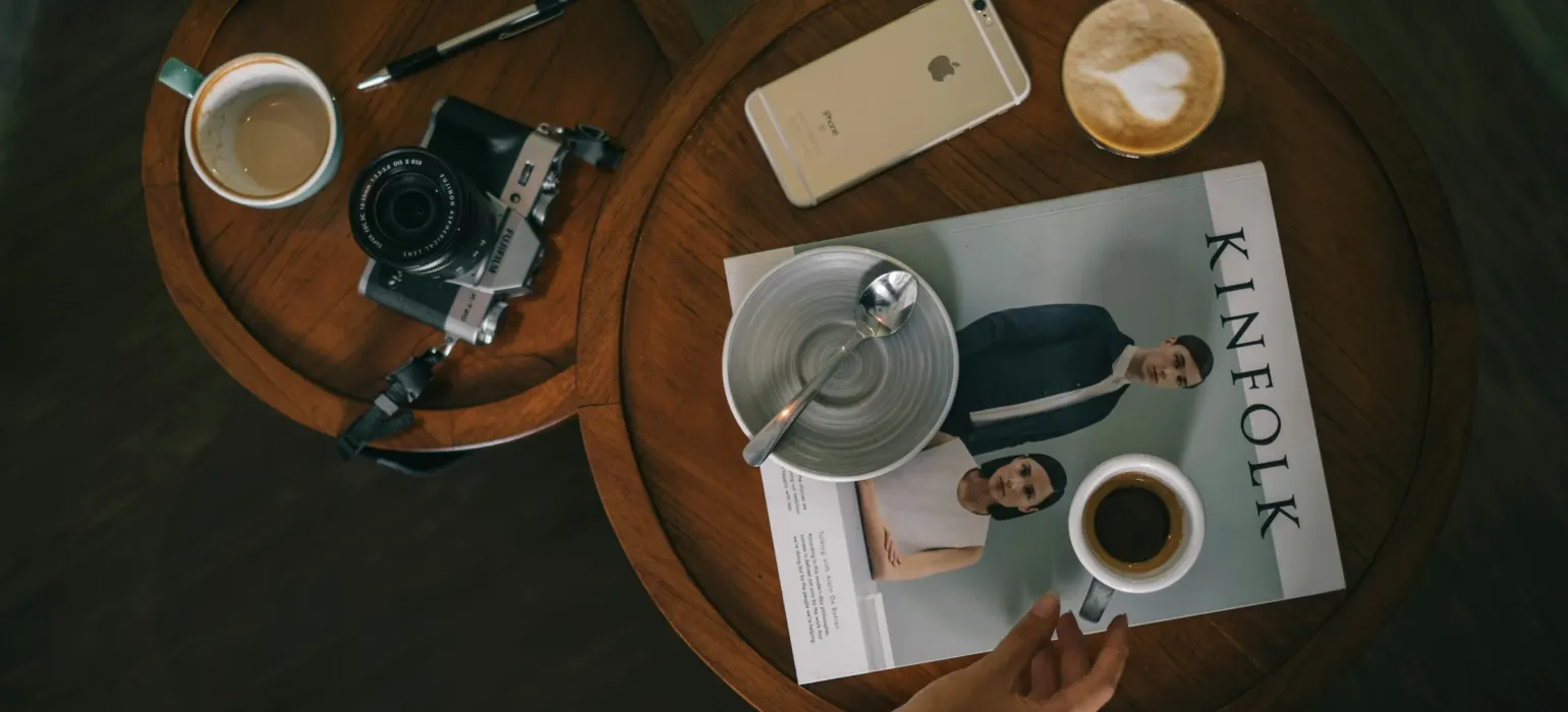 Person holding white ceramic mug