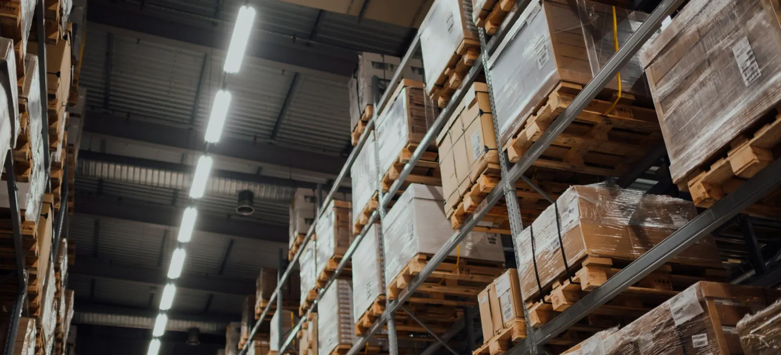 Warehouse shelves stacked with cardboard boxes