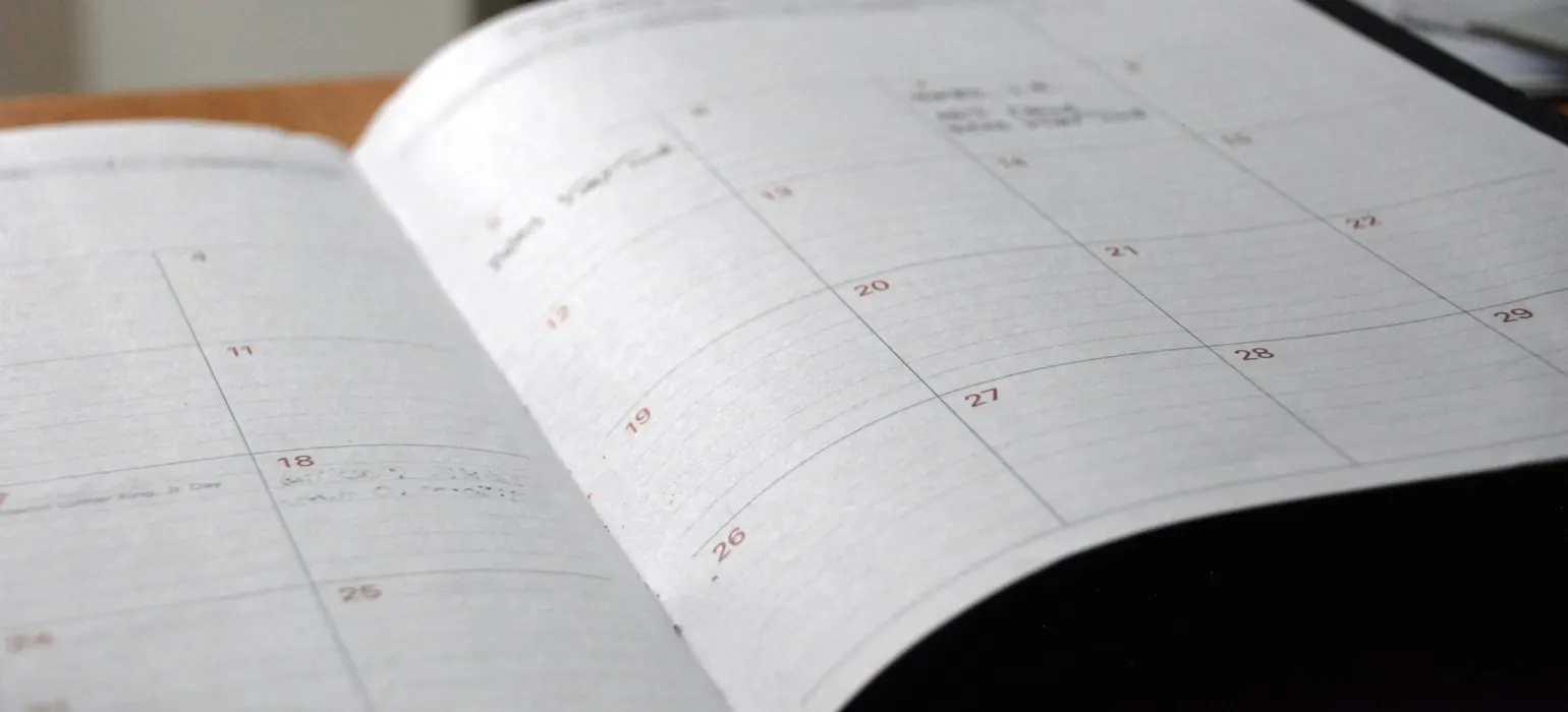 Open monthly planner on a desk