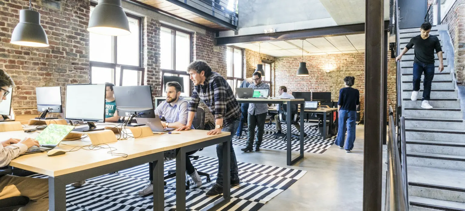 Employees working at desks in an open-plan office