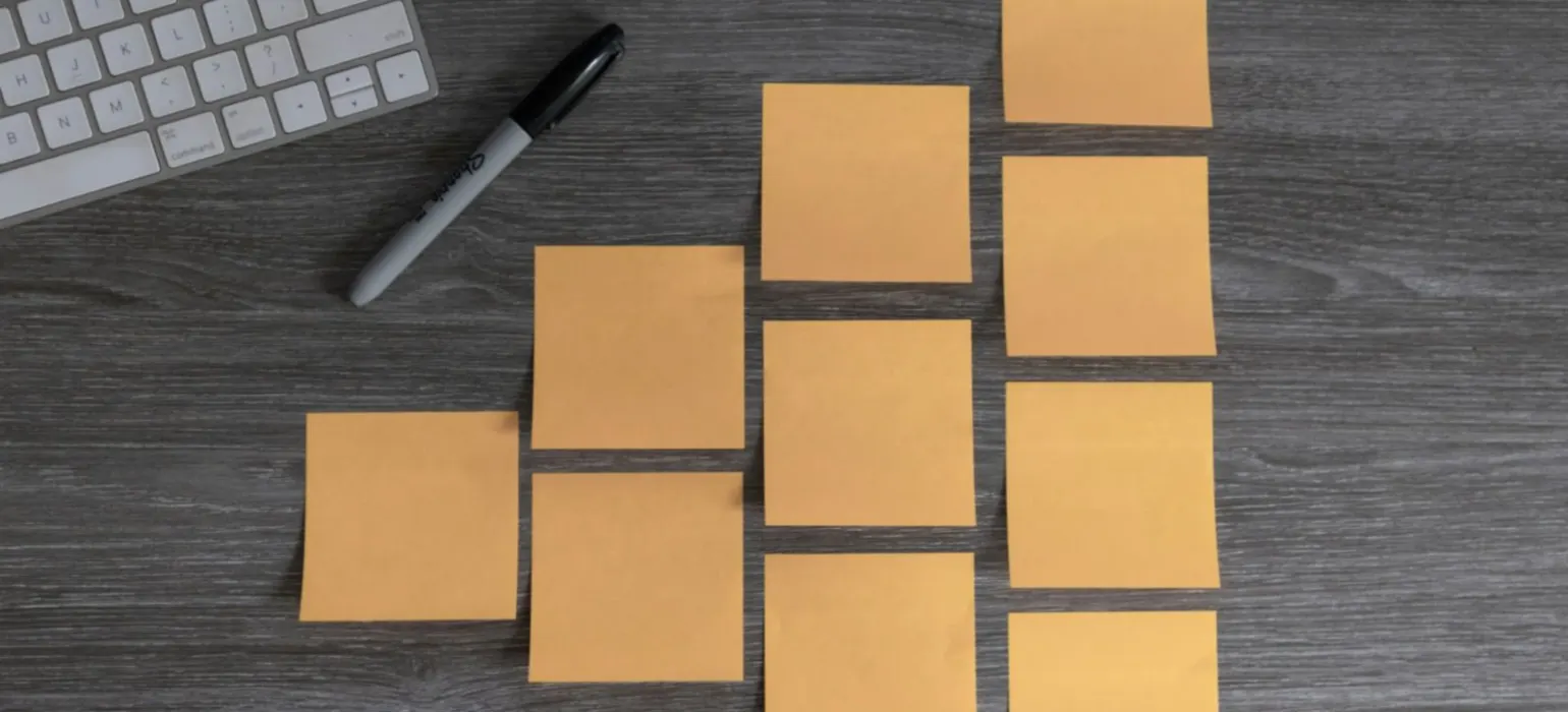 Yellow sticky notes beside white mouse and white keyboard