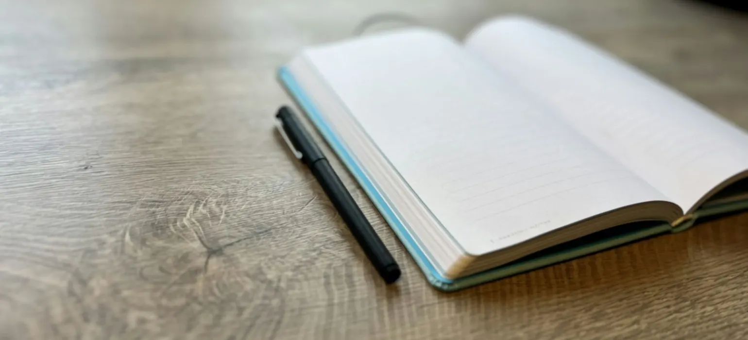 A pen on a book