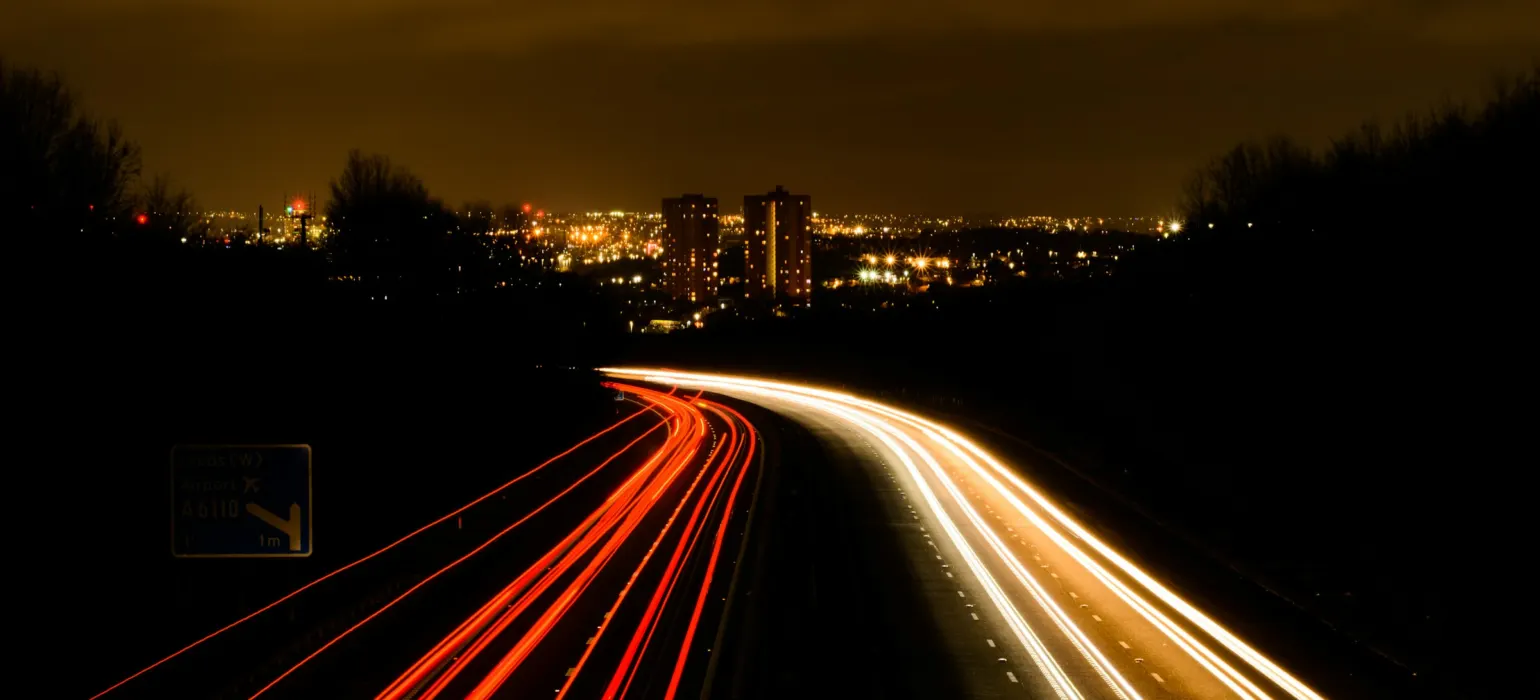 A long exposure shot of a highway at night