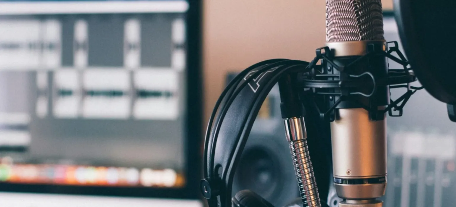 Black and silver headphones on black and silver microphone