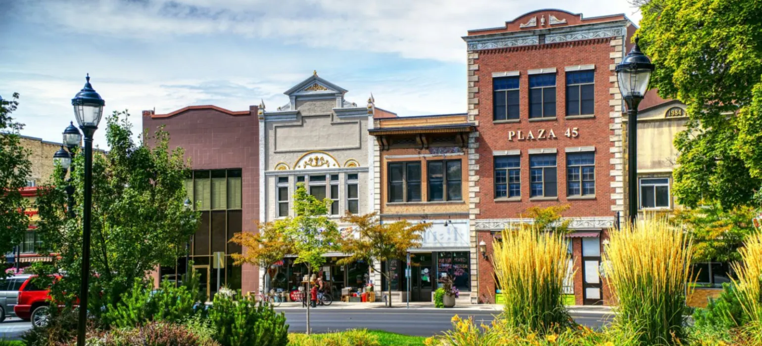 A brick building with a clock on the front of it