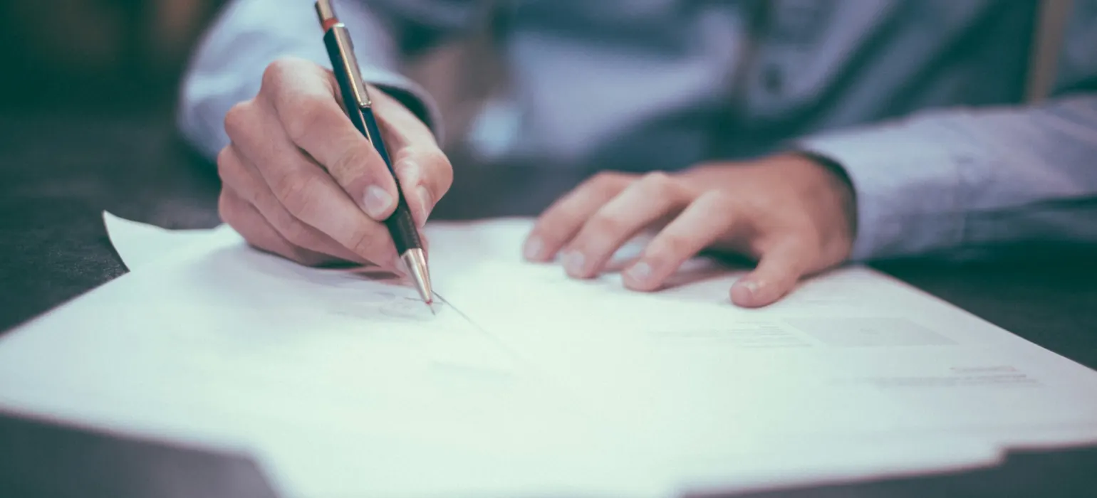 Man writing on paper