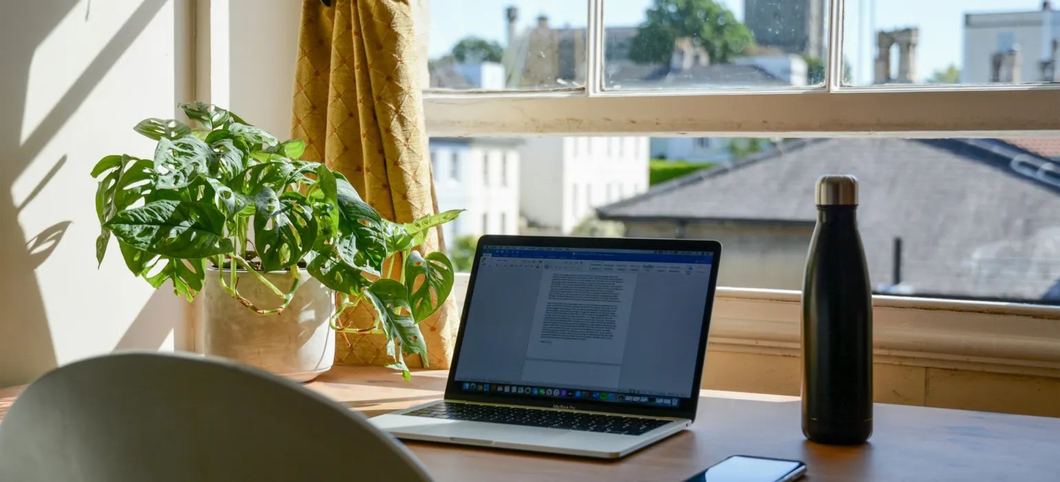 Macbook pro on brown wooden table