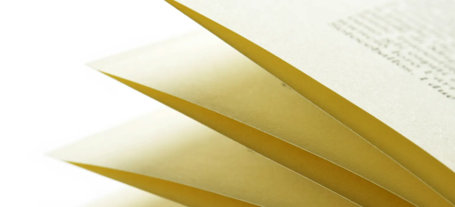Close-up of fanned printed pages