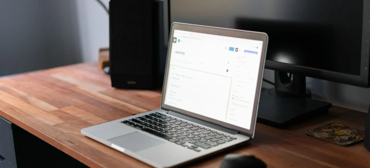 Macbook pro on brown wooden table