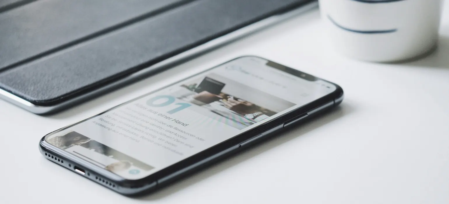 Black smartphone beside black smart case