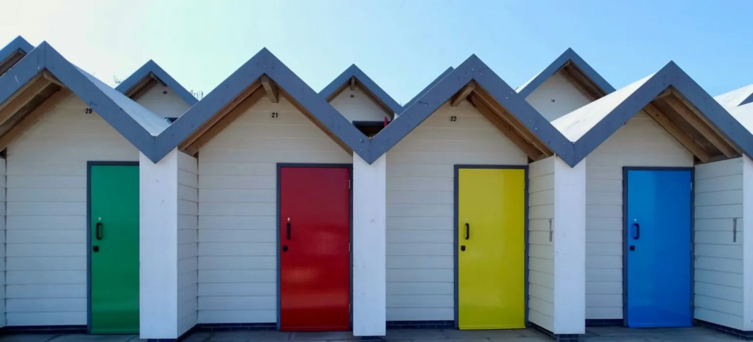 Yellow red green and blue wooden houses