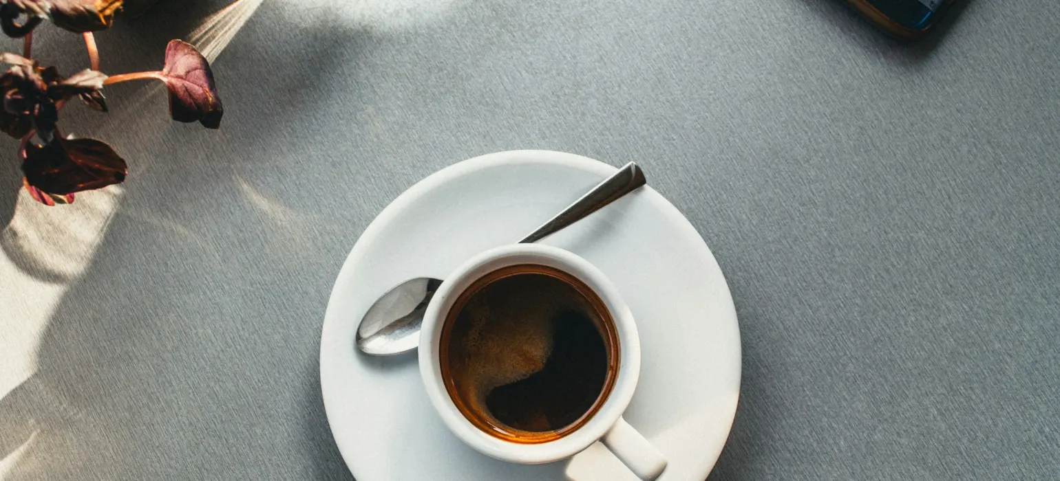 White ceramic mug on saucer