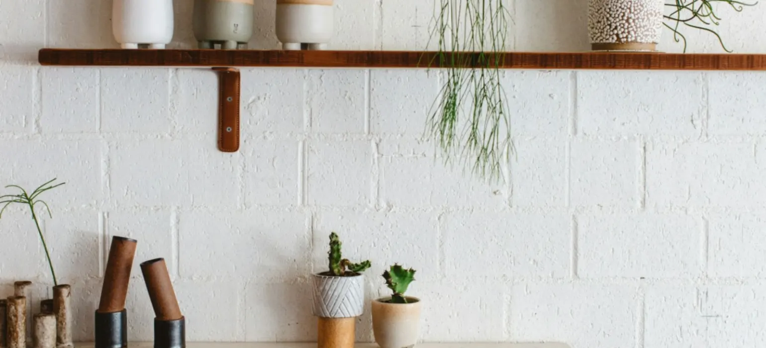 White ceramic mugs on brown wooden table
